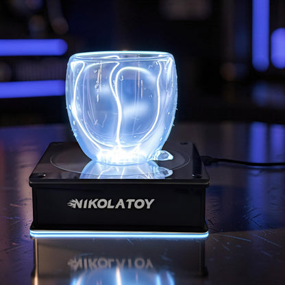 The Curious Mind Inert Gas Lightning Cup with display base, a glass and metal science display with blue electrical arcs.