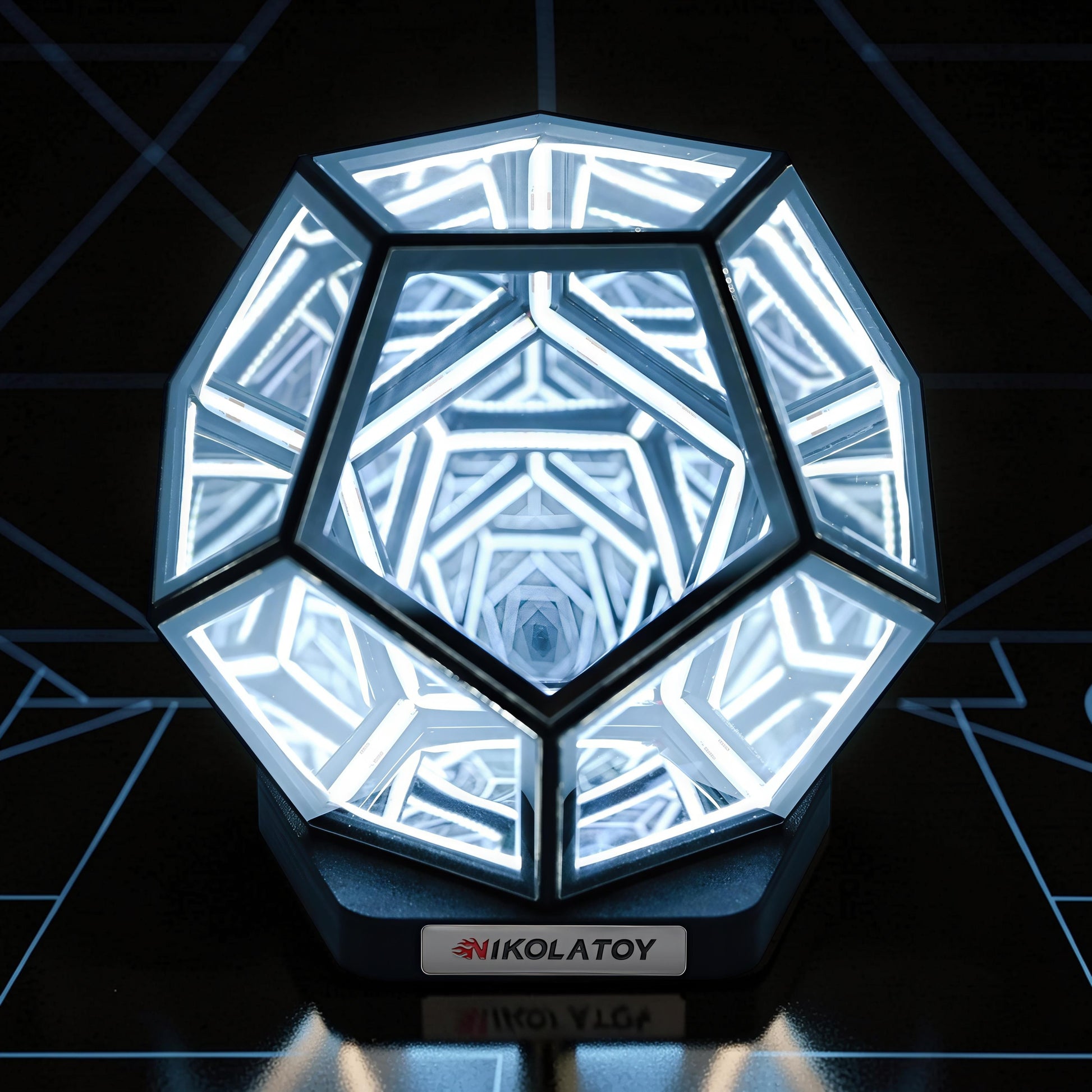 The Curious Mind Infinite Space Abyss Dodecahedron LED Night Light with white glowing geometric patterns.