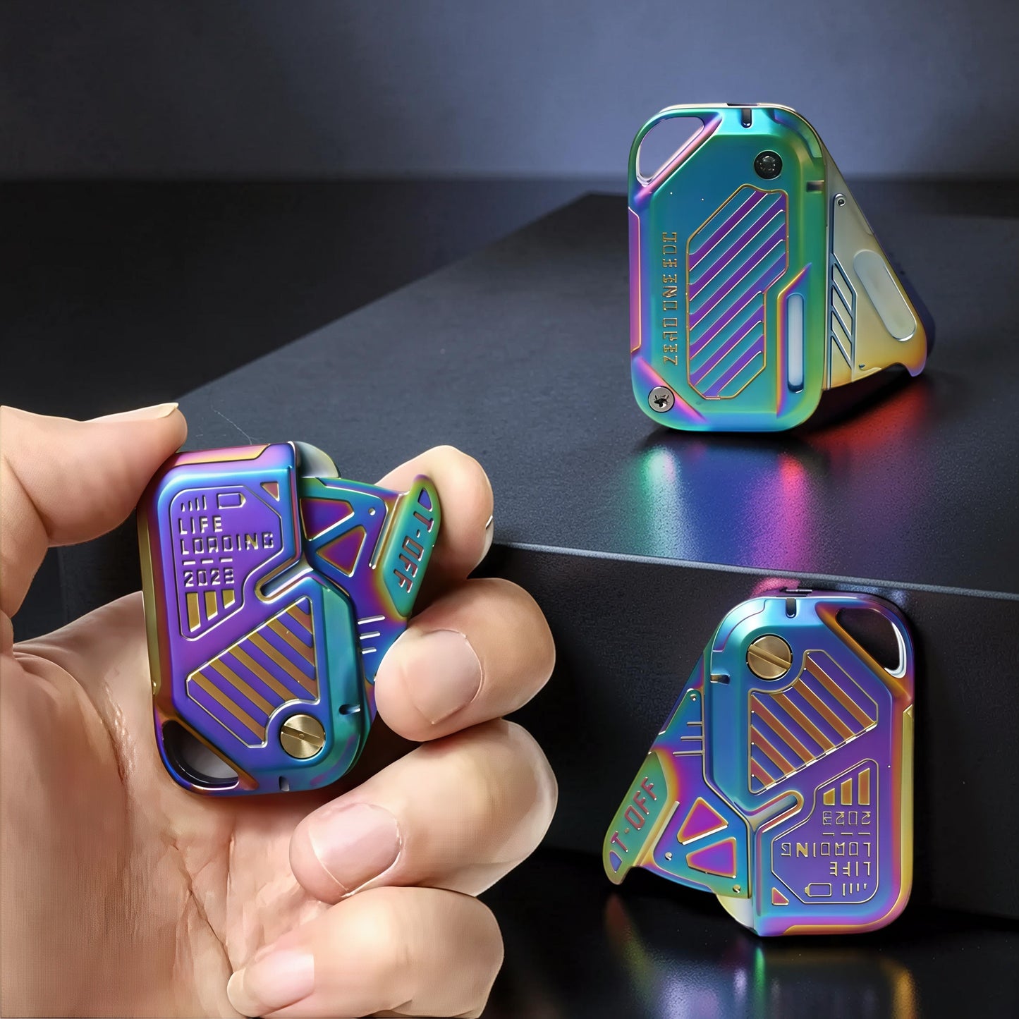 The Curious Mind Iridescent Chip Slider fidget toy in hand, made of metal with a push-and-return action and futuristic design.