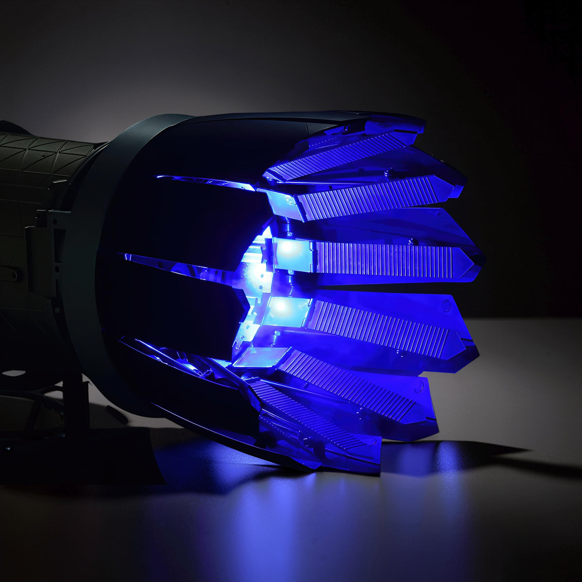 The Curious Mind Fighter Jet Turbofan DIY Kit model with illuminated blue turbine blades and intricate PLA construction.