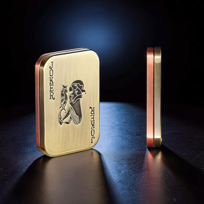 The Curious Mind Joker Poker magnetic slider fidget toy, gold and copper metal with Joker card design, compact and tactile.