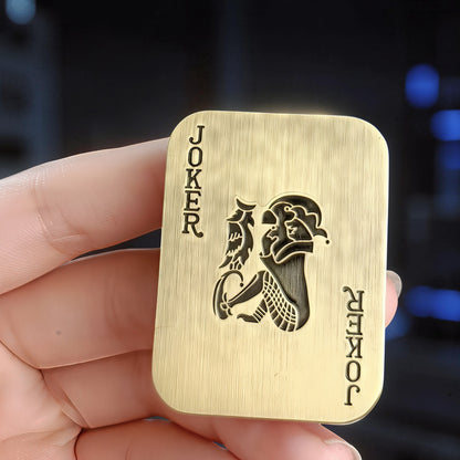 The Curious Mind Joker Poker magnetic slider fidget toy, brass metal, card design, for stress relief and EDC.