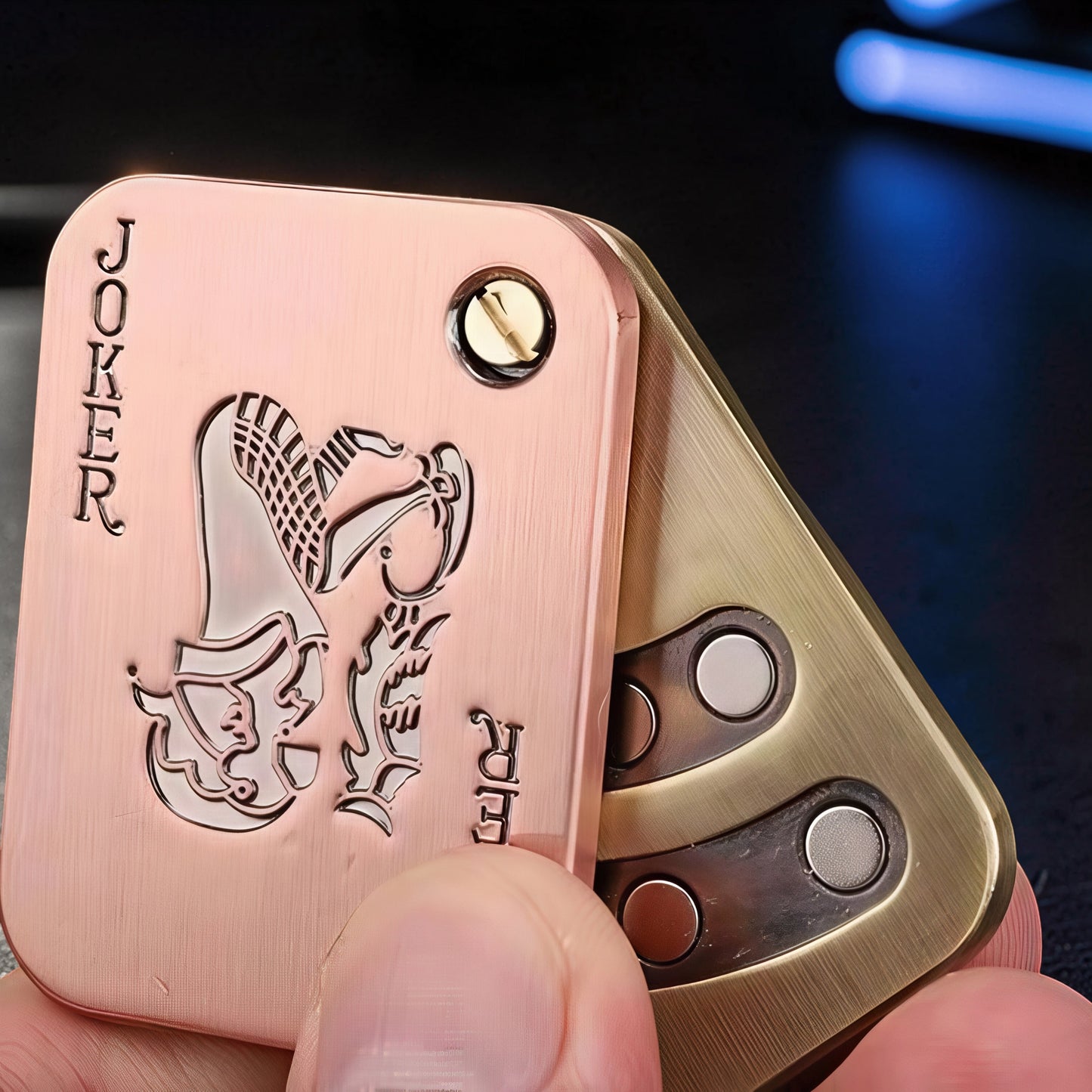 The Curious Mind Joker Poker Magnetic Slider fidget toy, brass and copper with joker card design. Satisfying magnetic slide action.