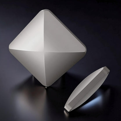 The Curious Mind Flipo Flip Square Desk Spinner, a brushed aluminum kinetic sculpture with a faceted design for mesmerizing motion and focus.