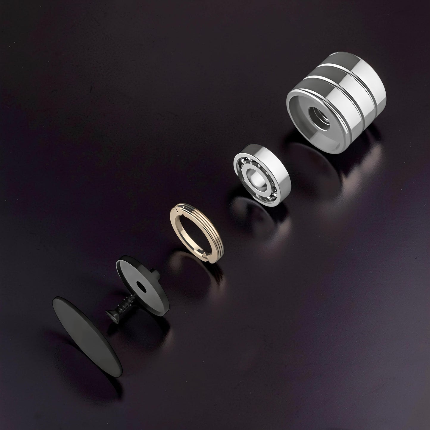 The Curious Mind Vortecon kinetic desk spinner disassembled: metal casing, bearing, gold ring, black base, and black cap.