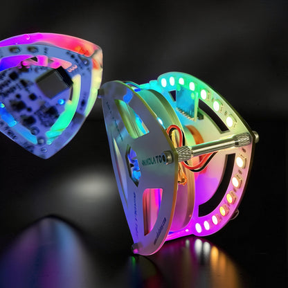 The Curious Mind Self-Balancing Lelo Triangle Kinetic Desk Toy with RGB LED lights, a modern desk accent.