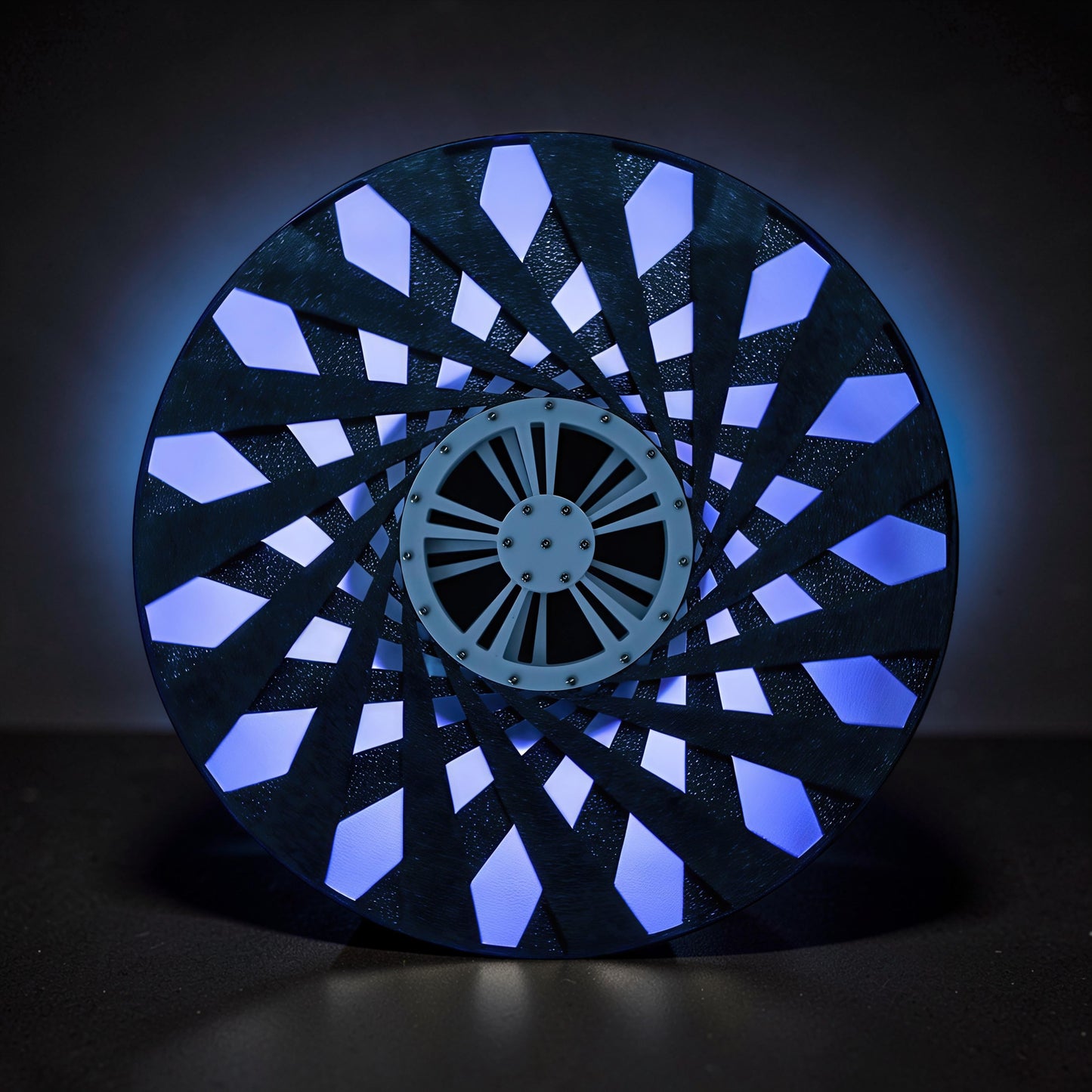 The Curious Mind Time Travel Edition desktop ornament, a black PLA kinetic sculpture with blue light emanating from within.