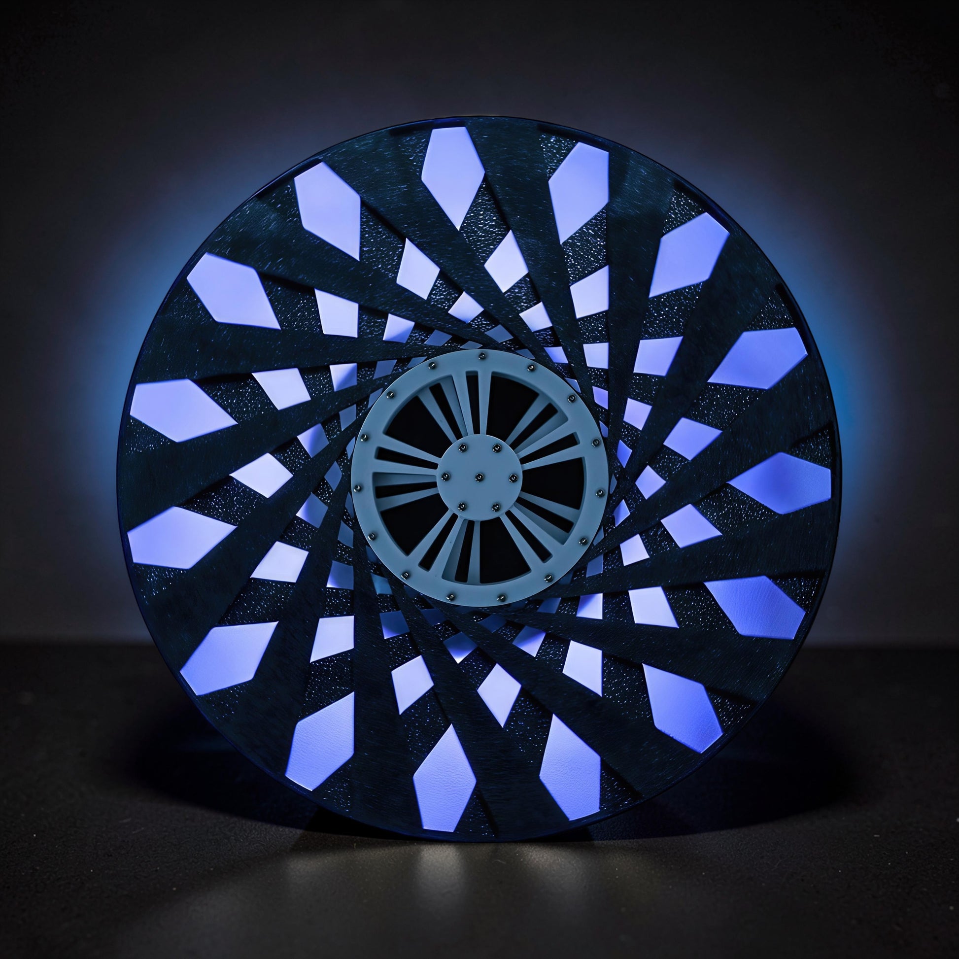 The Curious Mind Time Travel Edition desktop ornament, a black PLA kinetic sculpture with blue light emanating from within.