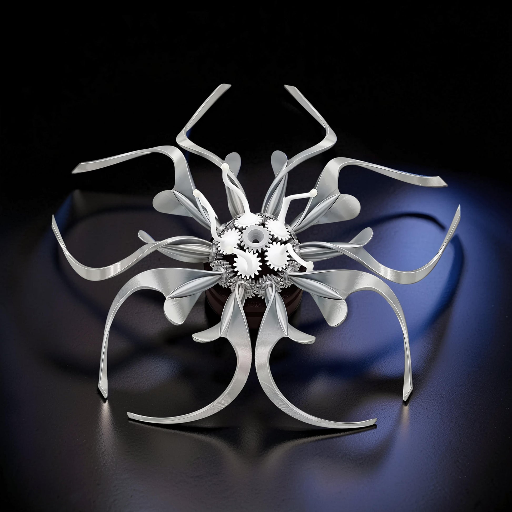 The Curious Mind Mechanical Kinetic Flowers Sculpture Gallery Edition, silver PLA with visible gears, a unique desk accent.