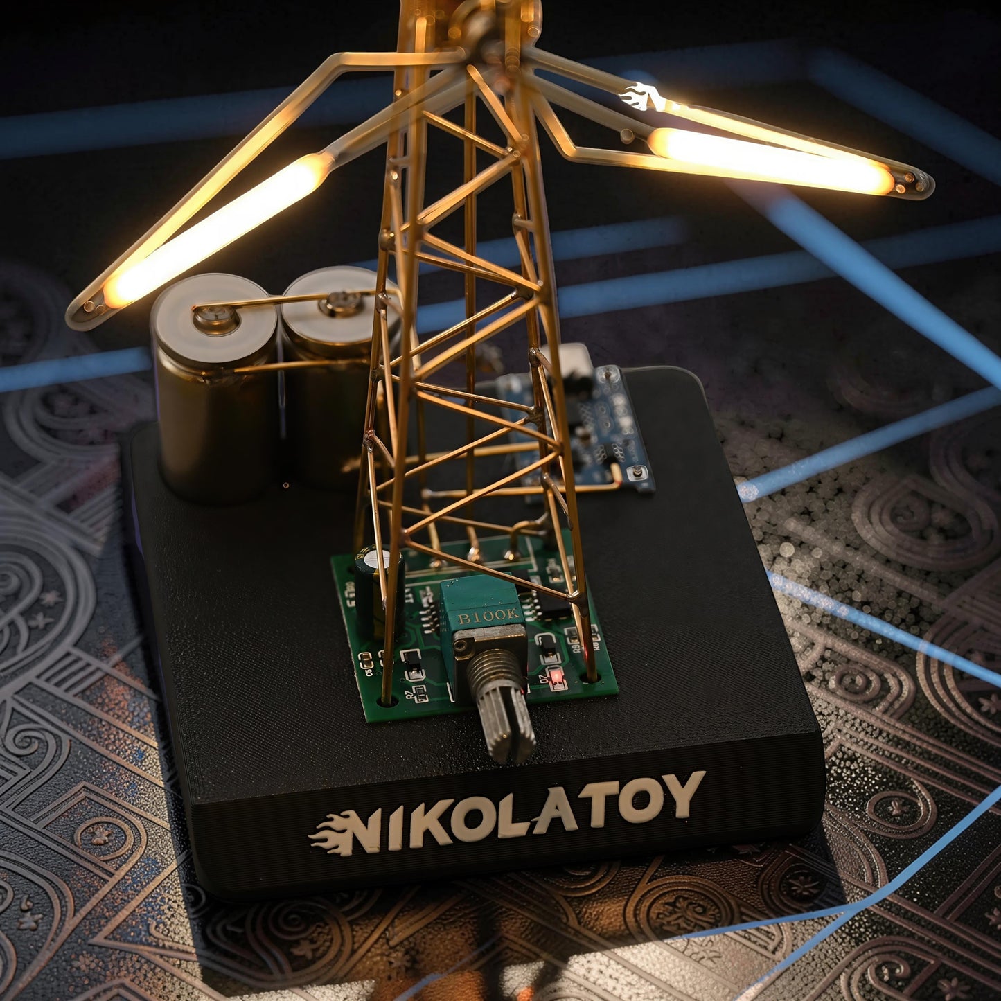 The Curious Mind LED Windmill Night Light, a DIY metal desk lamp with illuminated blades and exposed circuitry.