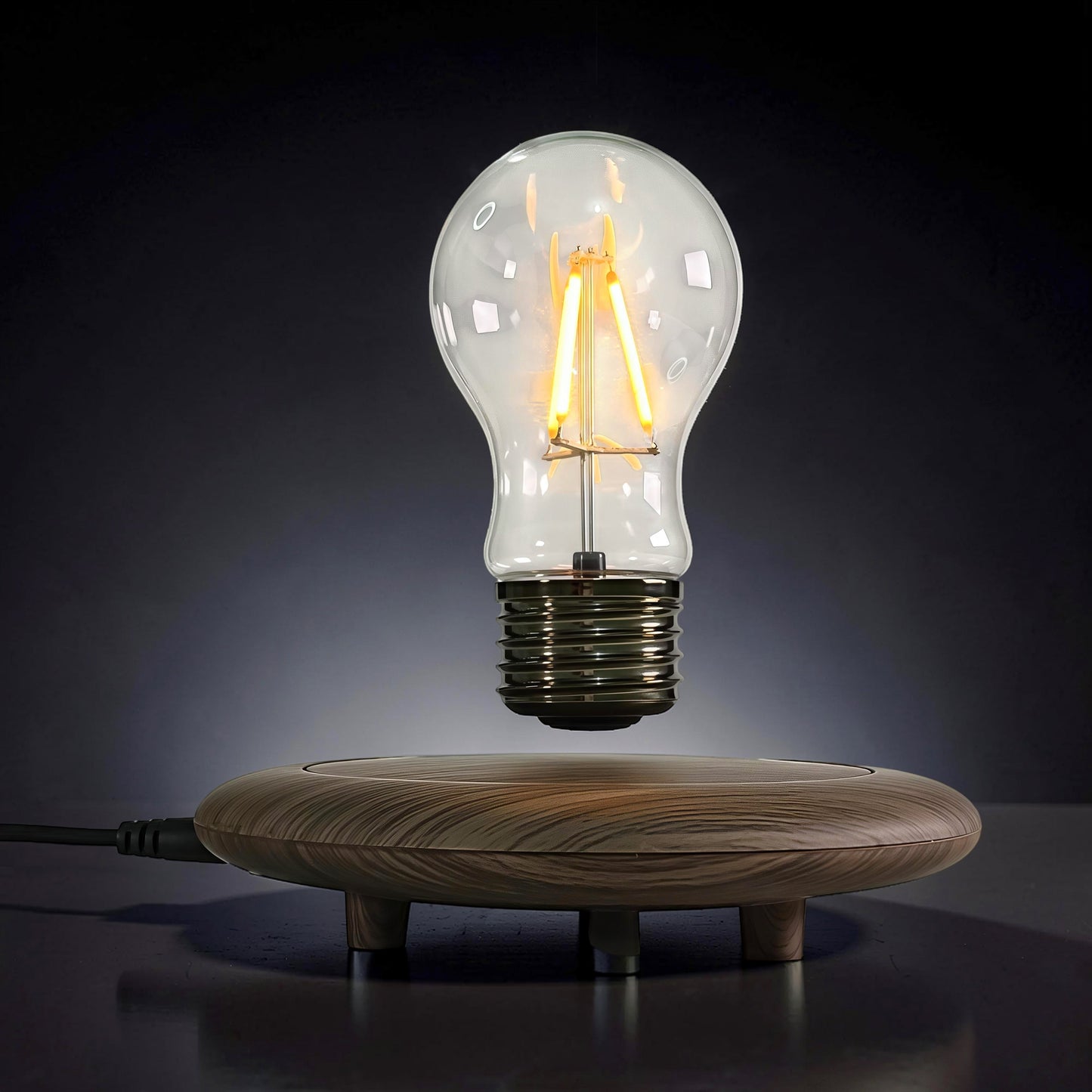 The Curious Mind High-Tech Levitating Light Bulb Ornament with wood base and clear glass bulb.