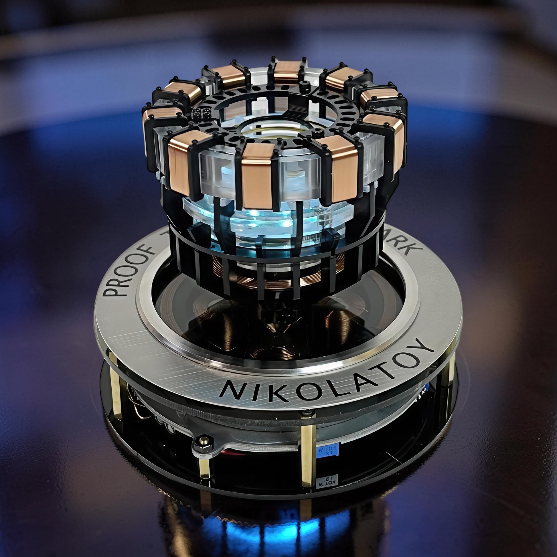 The Curious Mind Maglev Iron Man Ark Reactor Flagship HUD Edition, a metal desk object with blue glowing lights and copper accents.