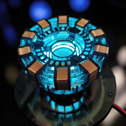 The Curious Mind Maglev Iron Man Ark Reactor Flagship HUD Edition, a metal desk object with glowing blue lights and copper coils.