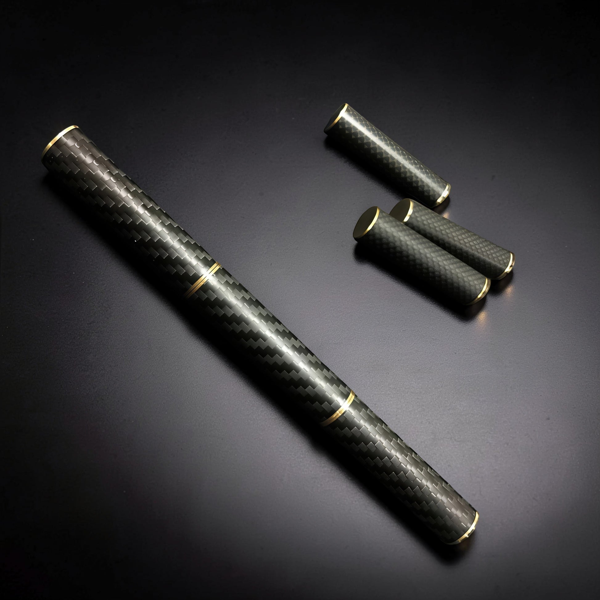The Curious Mind Magnetic Carbon Fiber Slider with gold accents. Compact, premium fidget toy for stress relief and focus.