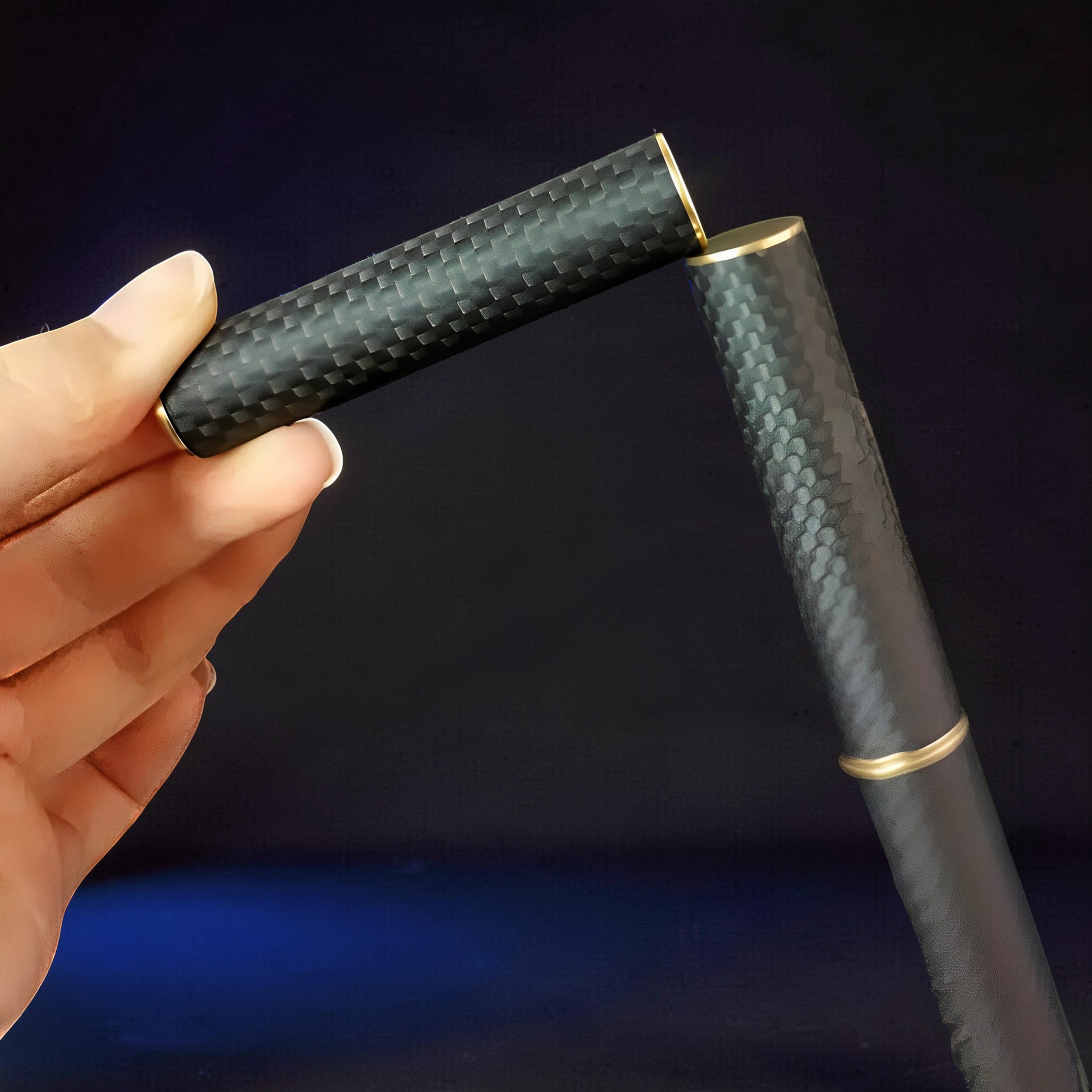 The Curious Mind Magnetic Carbon Fiber Slider with gold accents, featuring a push-and-return motion for stress relief.