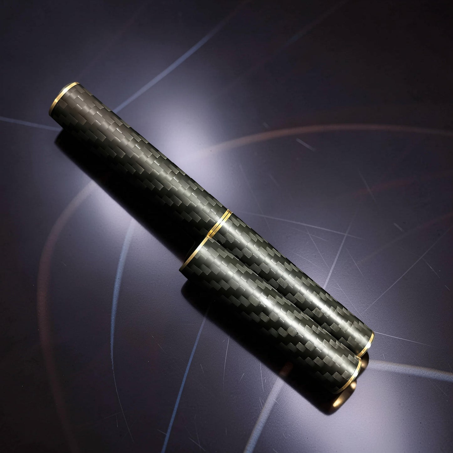 The Curious Mind Magnetic Carbon Fiber Slider with gold accents. Compact, premium fidget toy for stress relief and focus.