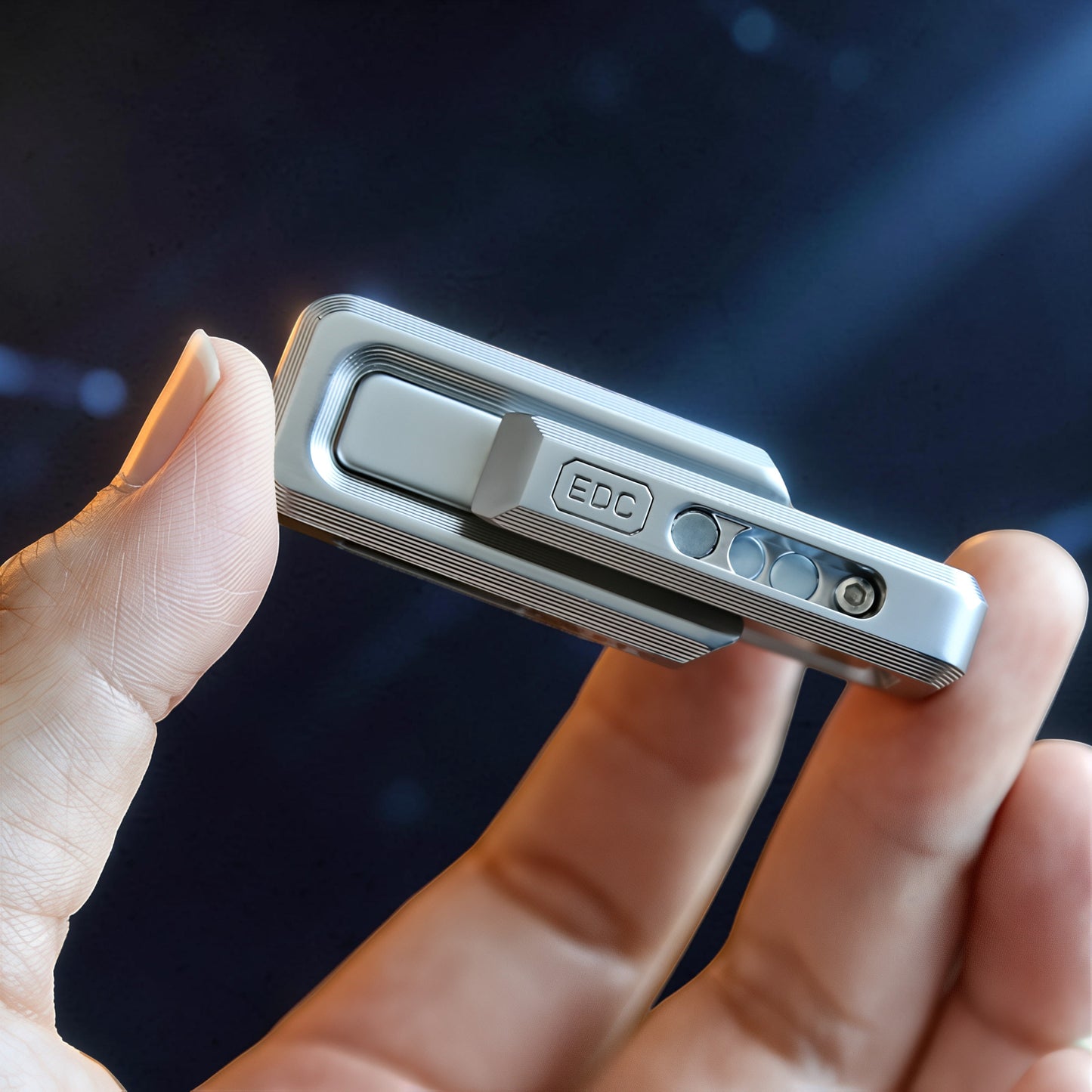 The Curious Mind premium magnetic double push slider fidget toy, made of silver metal with grooved detailing and an 'EDC' logo.
