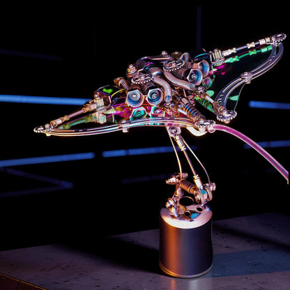 The Curious Mind Manta Ray premium 3D metal model kit, featuring intricate mechanical details and iridescent accents.