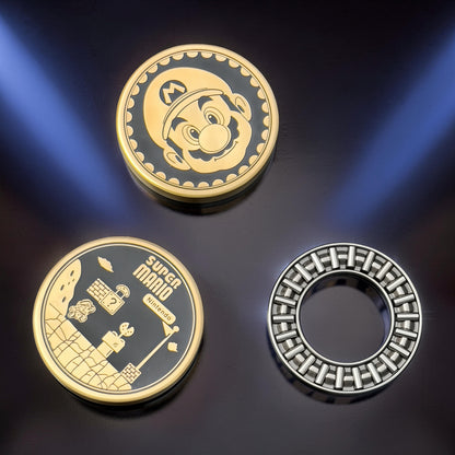 The Curious Mind Blacksmith Pop Coin Clicker fidget toy featuring Mario and Super Mario Nintendo game scenes. Metal construction.