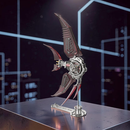 The Curious Mind Mechanical Angelfish 3D metal model kit with intricate gears and red accents, displayed on a stand.