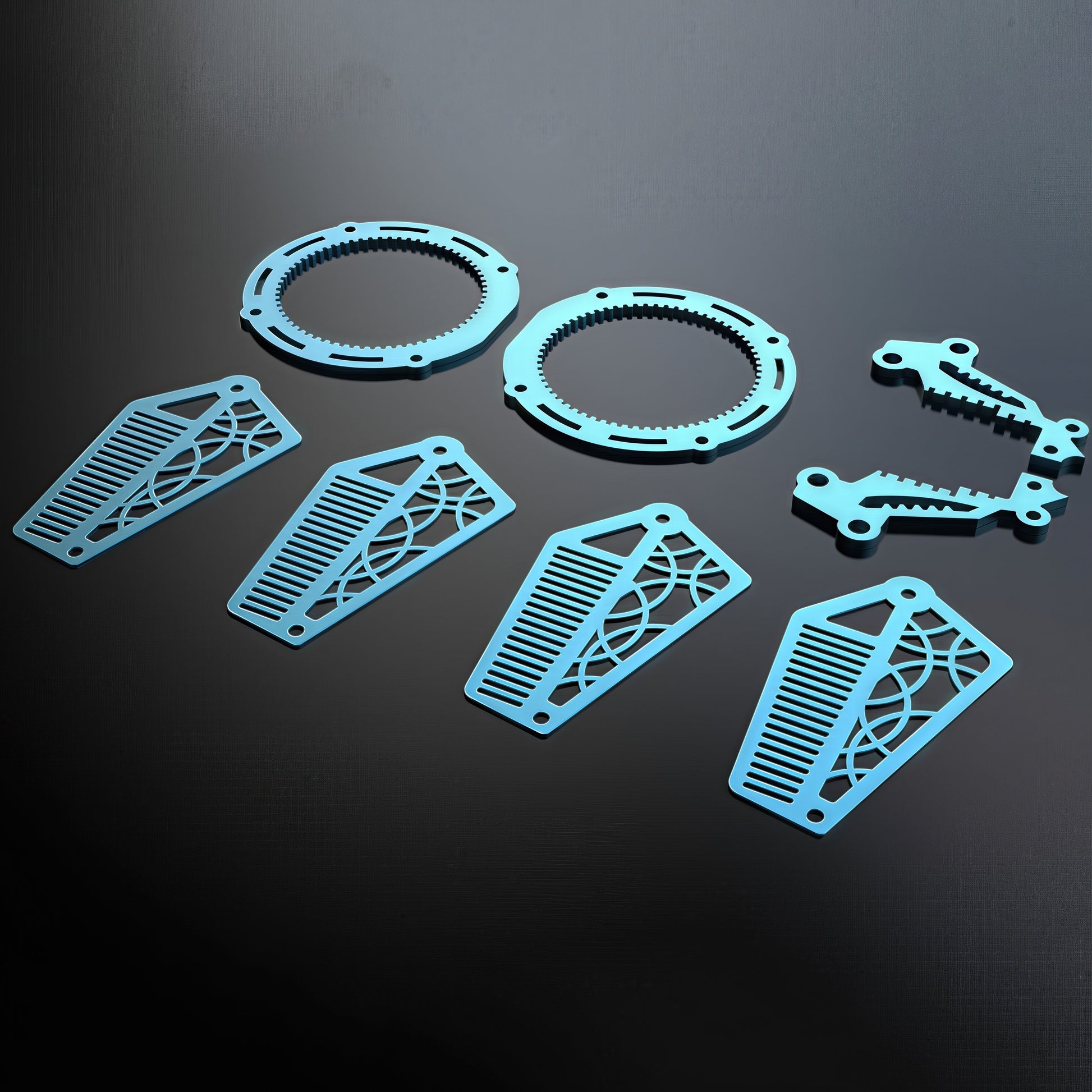 The Curious Mind Mechanical Angelfish 3D metal model kit pieces in light blue, featuring gear-like rings and decorative fins.