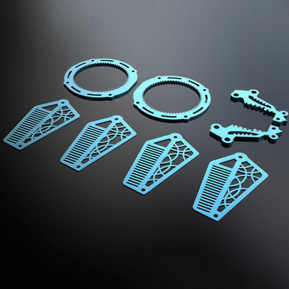The Curious Mind Mechanical Angelfish 3D metal model kit pieces in light blue, featuring gear-like rings and decorative fins.