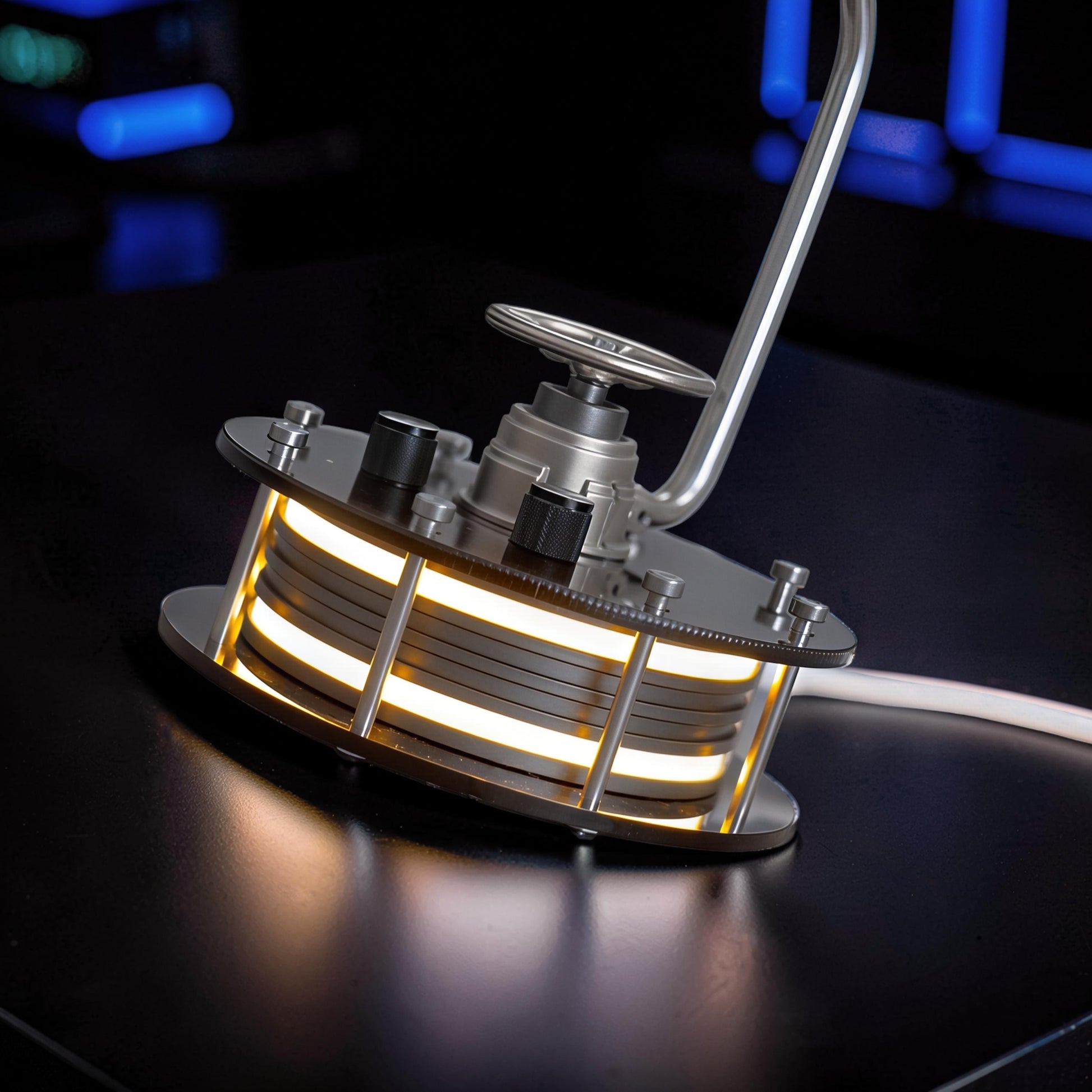 The Curious Mind mechanical ocean creature kit, a metal manta ray model with illuminated stacked layers and a silver control wheel.