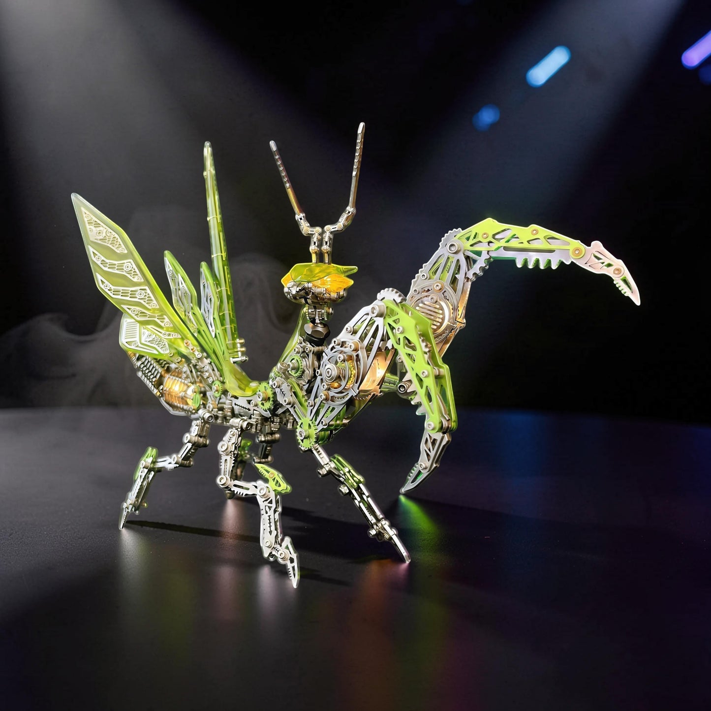 The Curious Mind Mechanical Mantis 3D metal model kit with intricate green and silver metallic details and translucent wings.