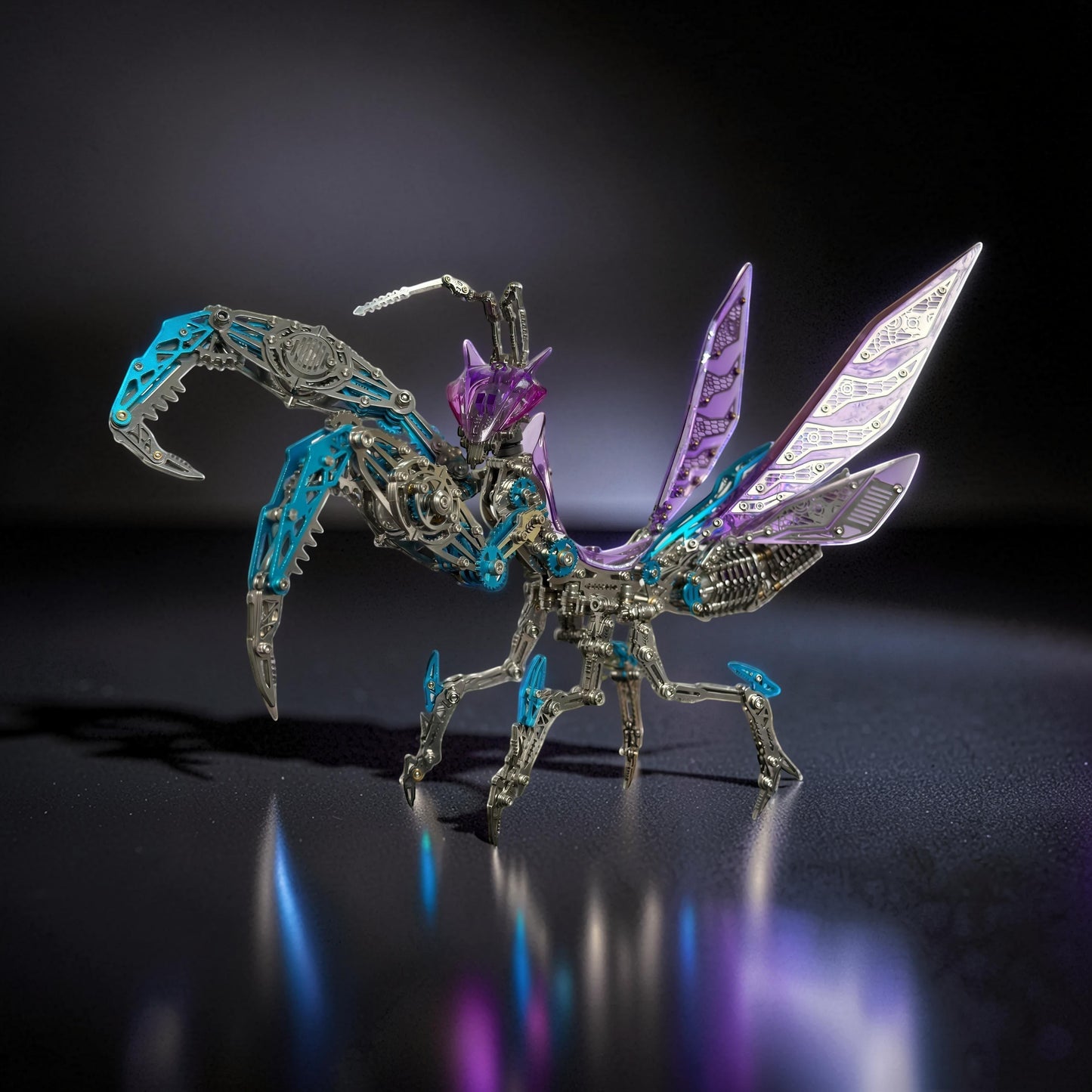 The Curious Mind Mechanical Mantis 3D metal model kit with intricate gears, purple translucent wings, and blue accents.