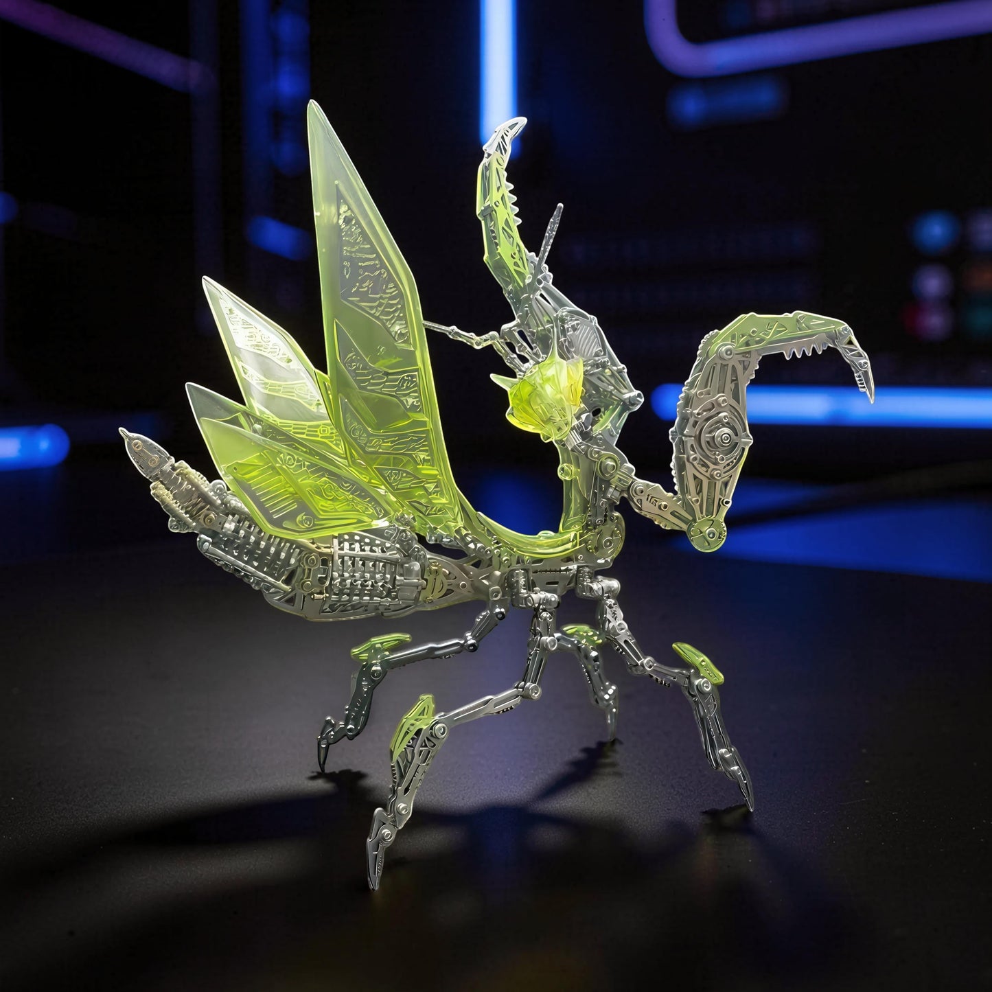 The Curious Mind Mechanical Mantis 3D metal model kit with translucent green wings and intricate silver mechanical details.