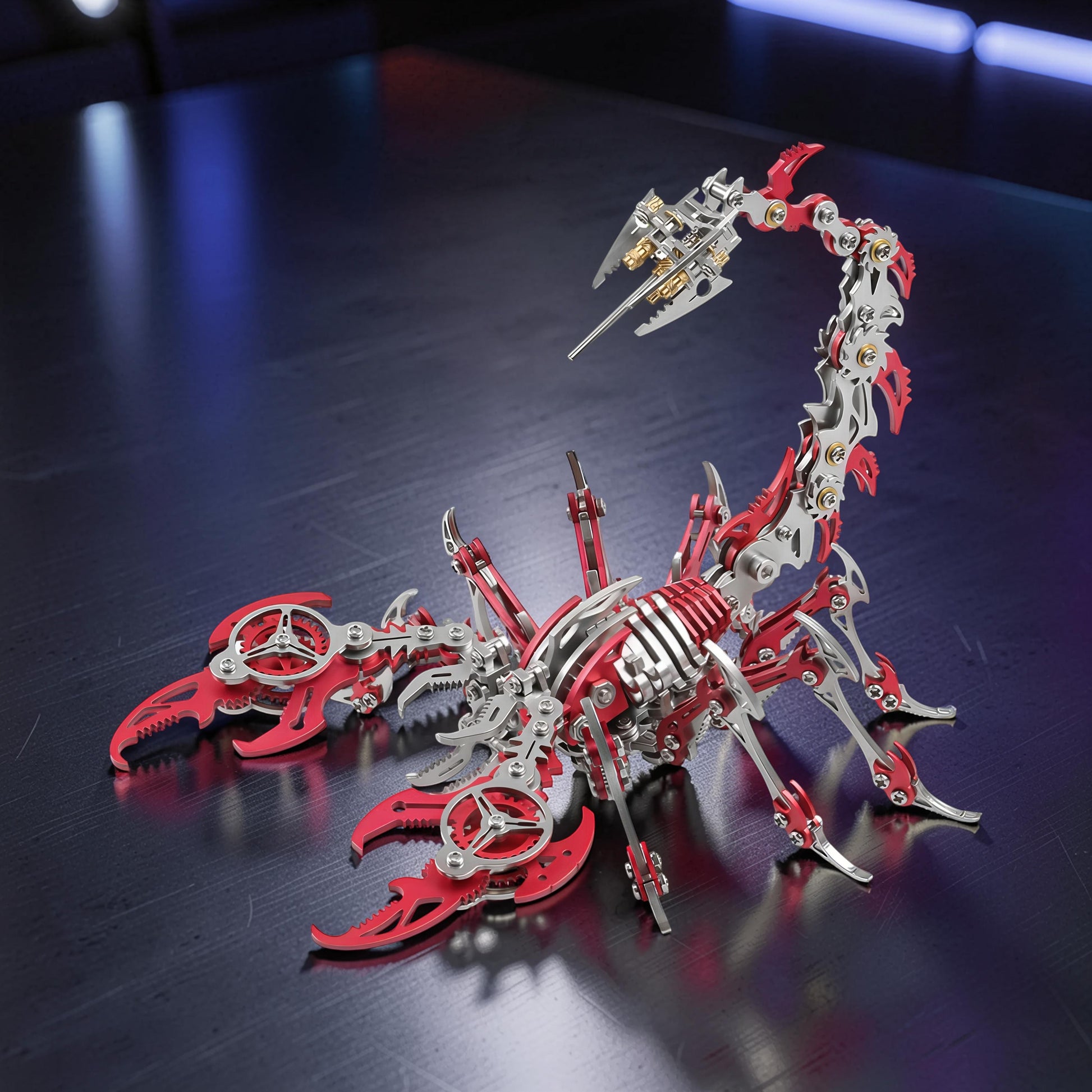 The Curious Mind Mechanical Scorpion 3D metal model kit in red and silver with intricate details and articulated limbs.