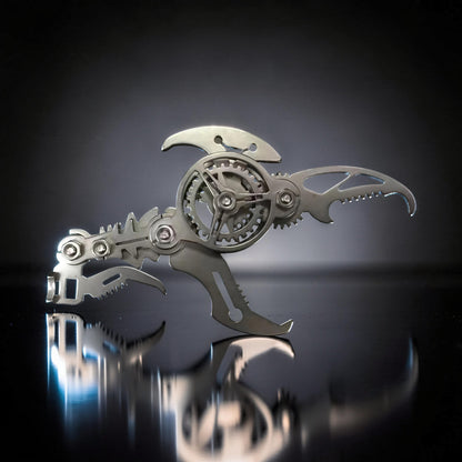 The Curious Mind Mechanical Scorpion 3D metal model kit in silver with intricate gears and a scorpion-like tail.