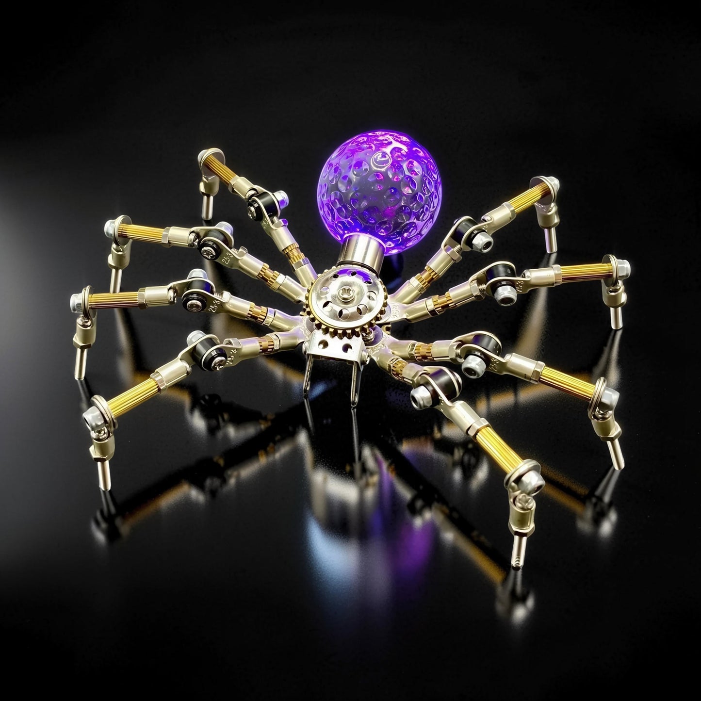 The Curious Mind Style G mechanical spider DIY kit, made of metal, with a purple glowing orb.