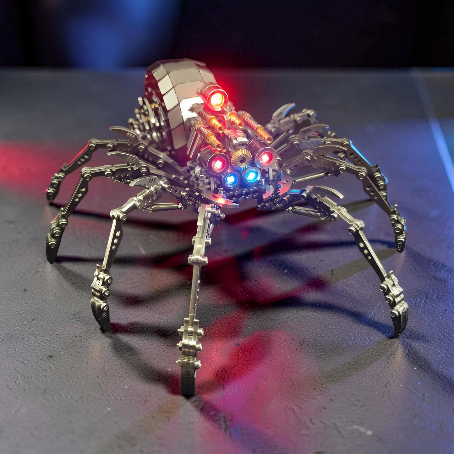 The Curious Mind Mechanical Spider 3D metal model kit with intricate details and red and blue LED lights.