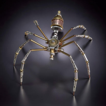 The Curious Mind Style C mechanical spider model kit, made of metal with brass and silver accents, featuring intricate gears and articulated legs.