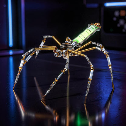 The Curious Mind mechanical spider model kit, made of metal with gold and silver accents, featuring a glowing green vial.