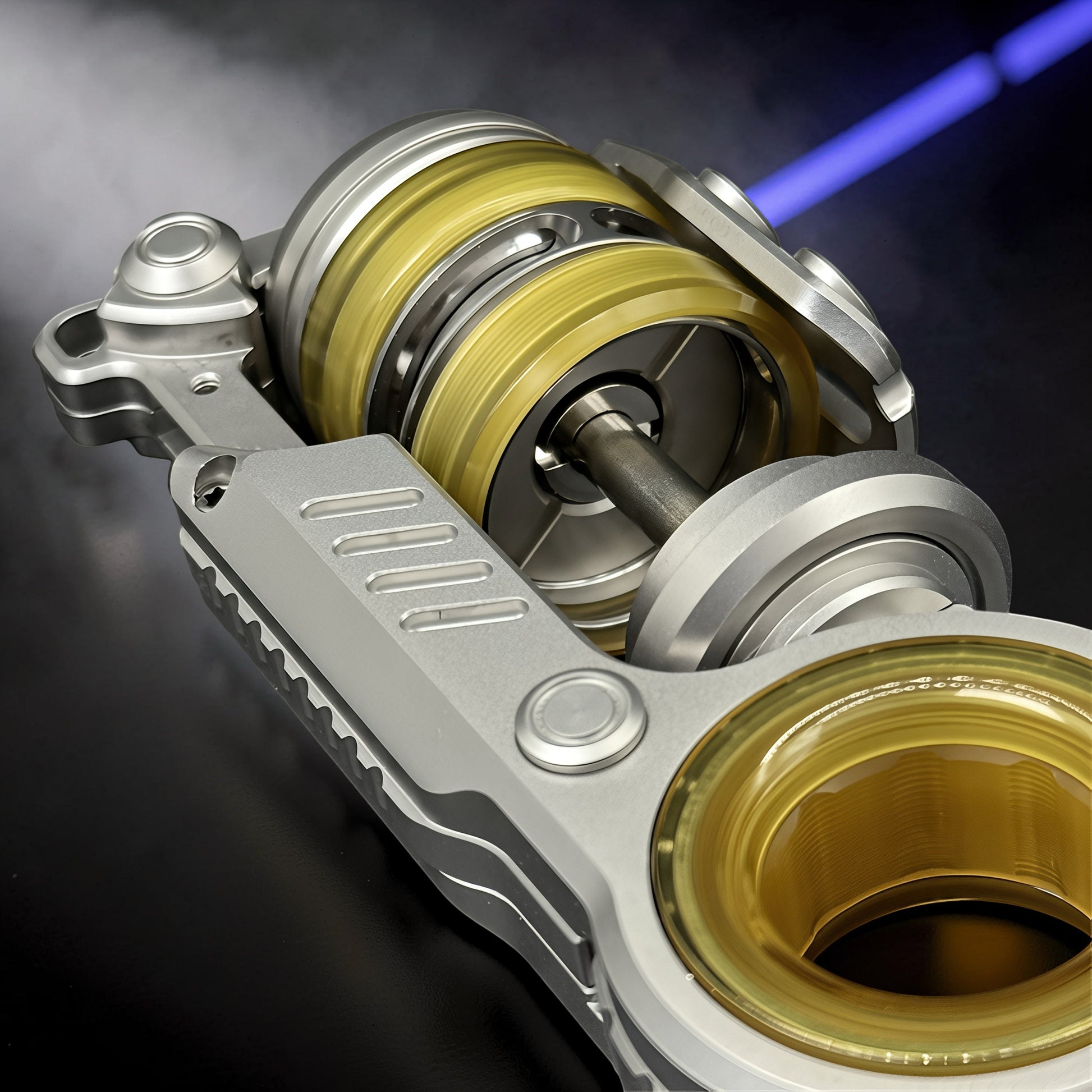 The Curious Mind Fork Ratchet Metal Slider fidget toy with yellow accents and silver metal construction.