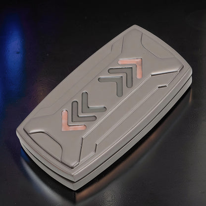 The Curious Mind Arrow Pusher Click Slider fidget toy, a compact metal slider with grey and copper accents, designed for stress relief and focus.