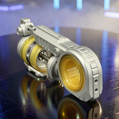 The Curious Mind Fork Ratchet Metal Slider fidget toy with yellow accents and a sleek, compact design.