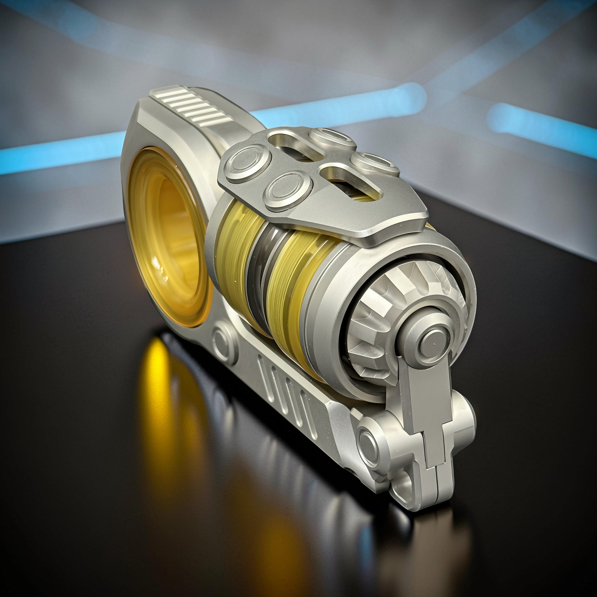 The Curious Mind Fork Ratchet Metal Slider fidget toy with yellow and black internal rings and a silver metallic finish.