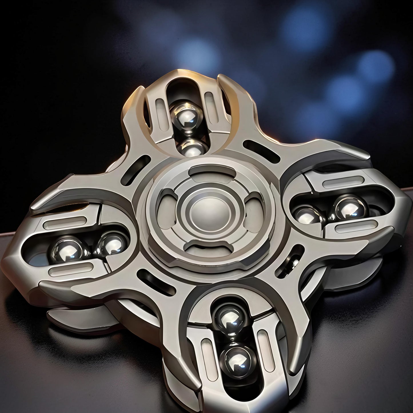 The Curious Mind Oracle Metal EDC Fidget Spinner with silver finish and visible ball bearings.