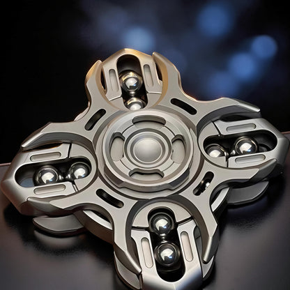 The Curious Mind Oracle Metal EDC Fidget Spinner with silver finish and visible ball bearings.