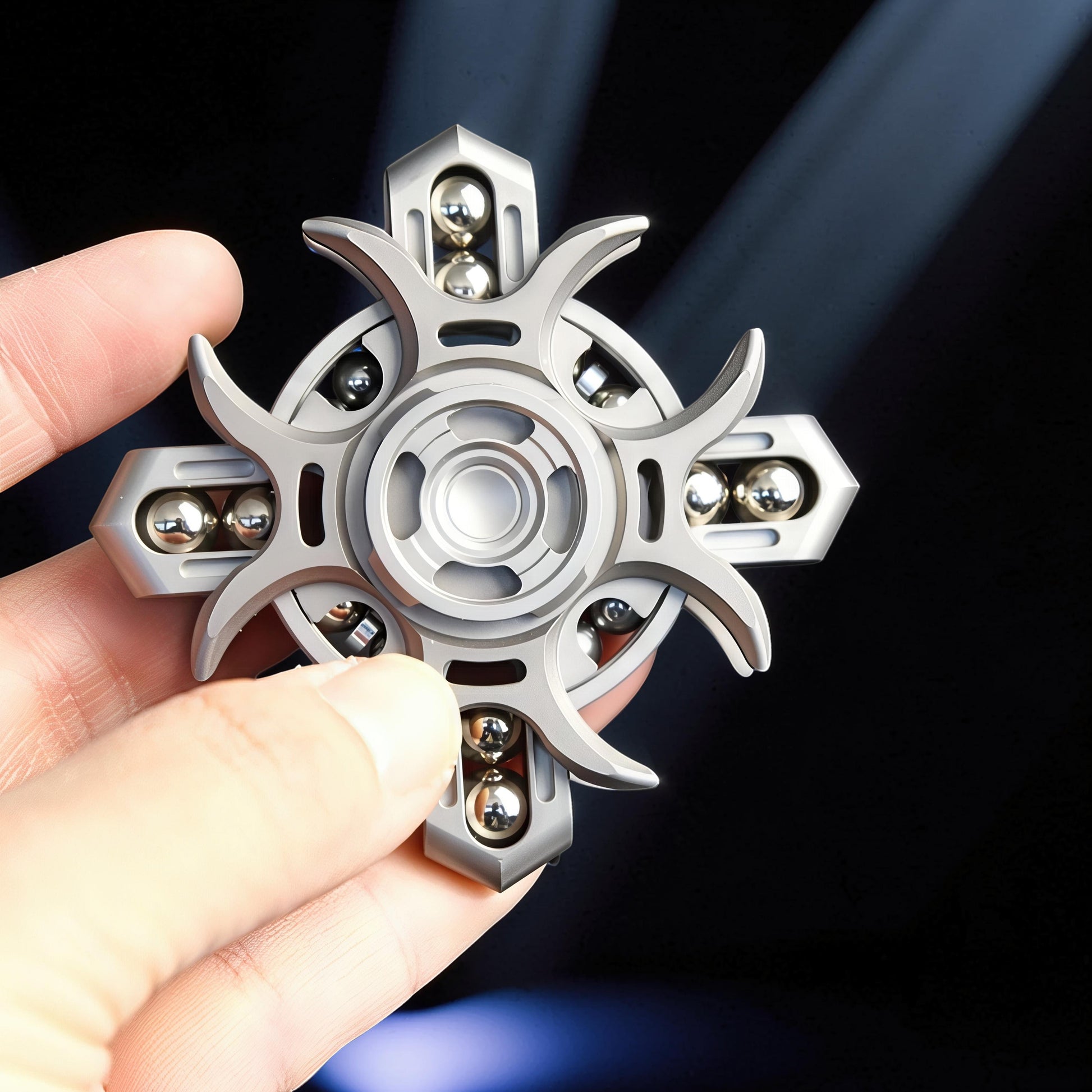 The Curious Mind Oracle Metal EDC Fidget Spinner with a silver finish, featuring a unique starburst design and multiple ball bearings for smooth tactile play.