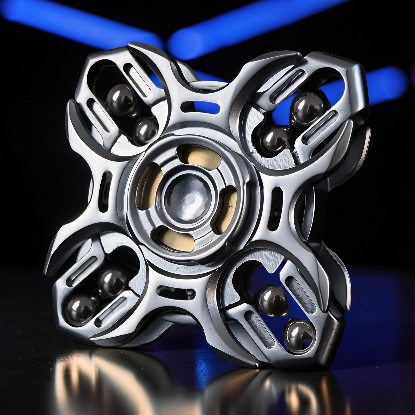 The Curious Mind Oracle Metal EDC Fidget Spinner, silver, with four arms each holding three ball bearings, for tactile focus and stress relief.