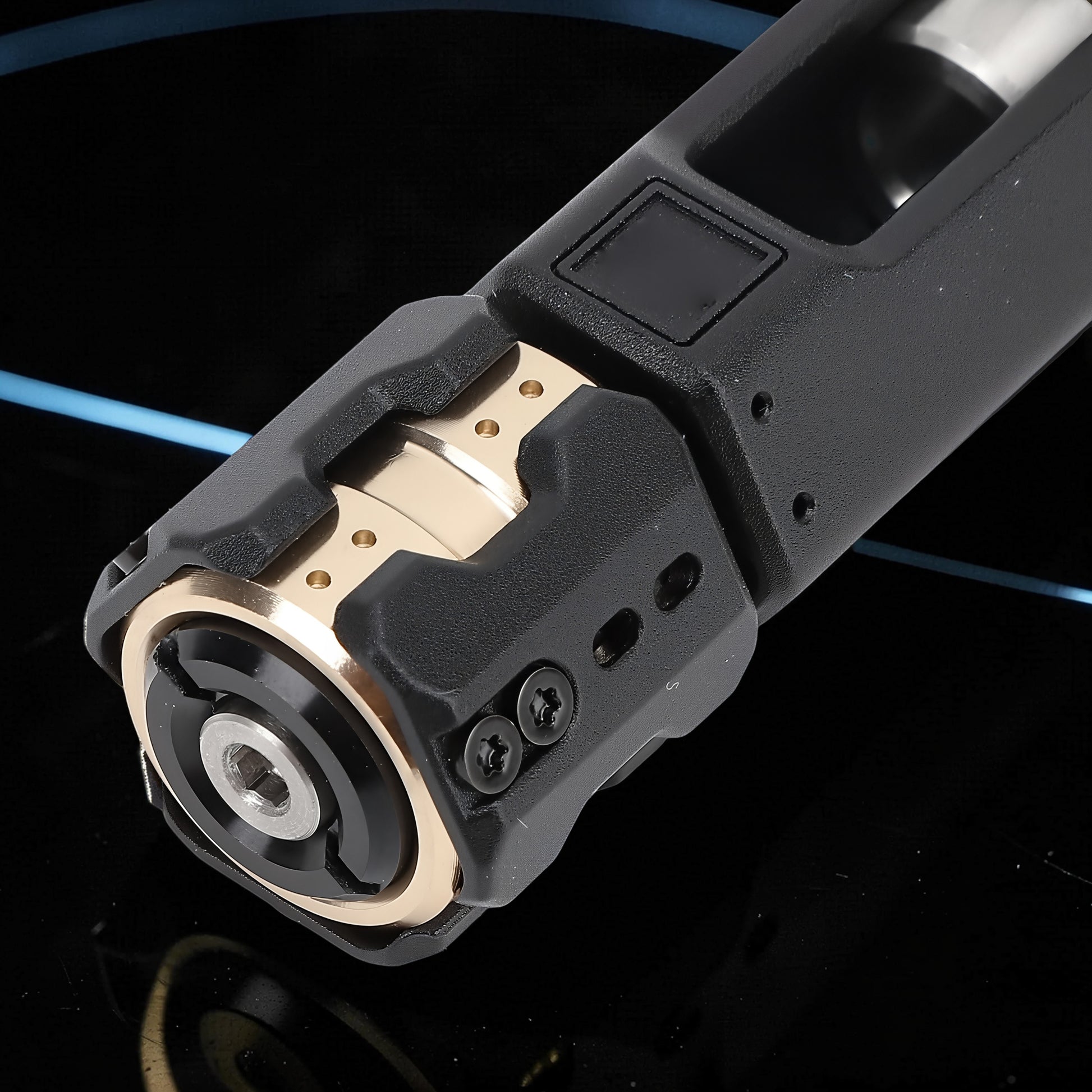 The Curious Mind Musketeers Snap Coin Clicker fidget toy, black metal with gold accents, compact and portable.