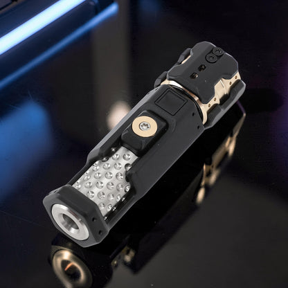 The Curious Mind Musketeers Snap Coin Clicker fidget toy in black metal with gold accents and a textured grip.