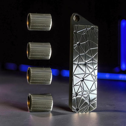 The Curious Mind Pea Pod Pop Coin Clicker fidget toy, silver metal with geometric pattern and four detachable pods.