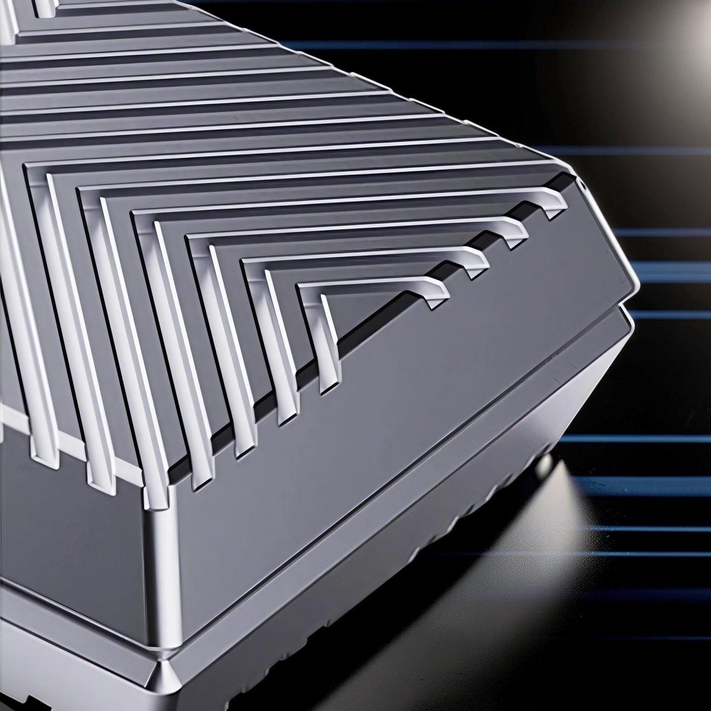 The Curious Mind Cube Push Slider, a compact metal fidget toy with a stepped, layered design in silver.