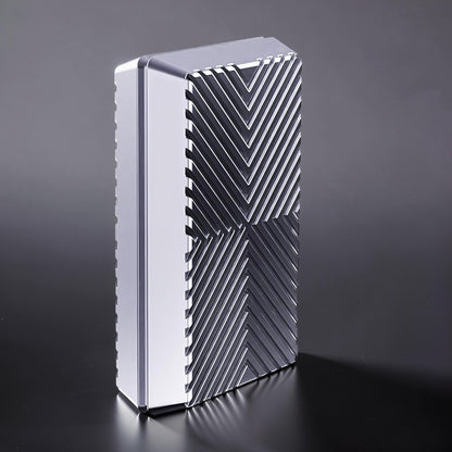 The Curious Mind Cube Push Slider: compact metal fidget toy with geometric grooved pattern and satisfying push-and-return action.