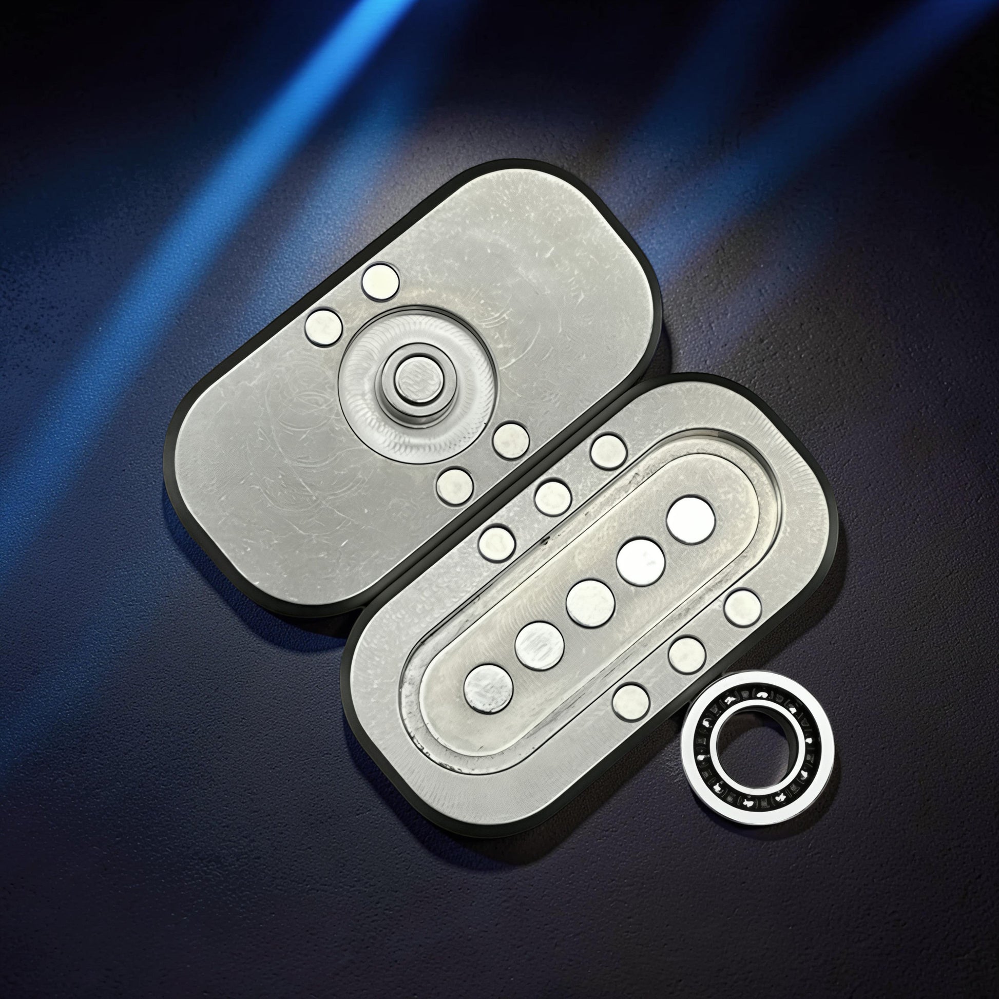The Curious Mind Owl Push Slider fidget toy, compact metal design with magnetic push-and-return action and bearing.